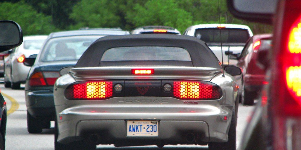 Cars queuing in slow traffic on a multi-lane highway