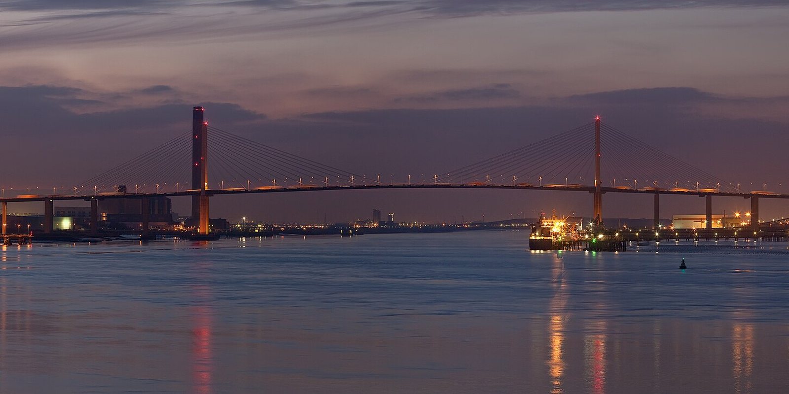 The Queen Elizabeth II Bridge at Dartford at dusk, lit along its length
