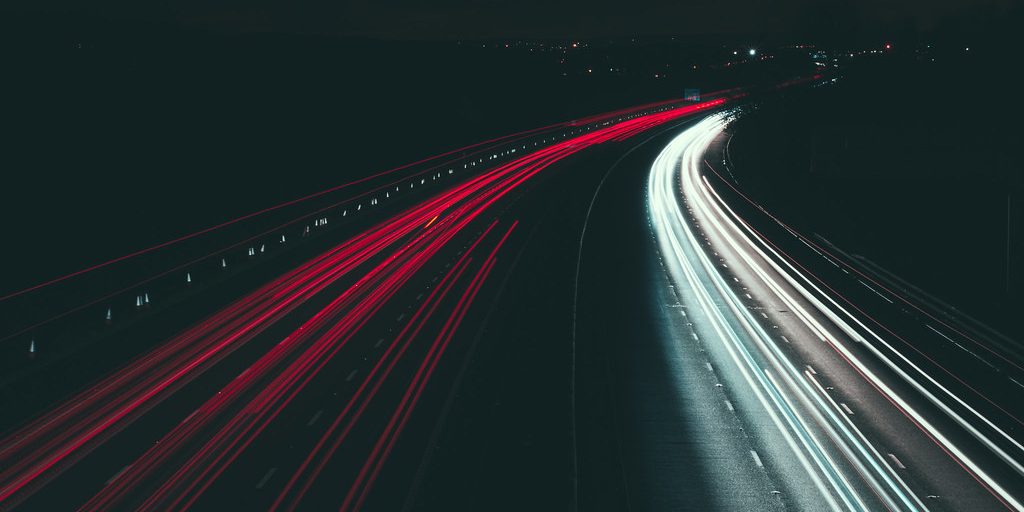 Light trails from traffic on a motorway at night